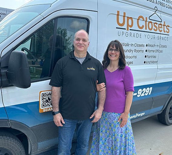 Gloria and Mike Jordahl with the Up Closets van